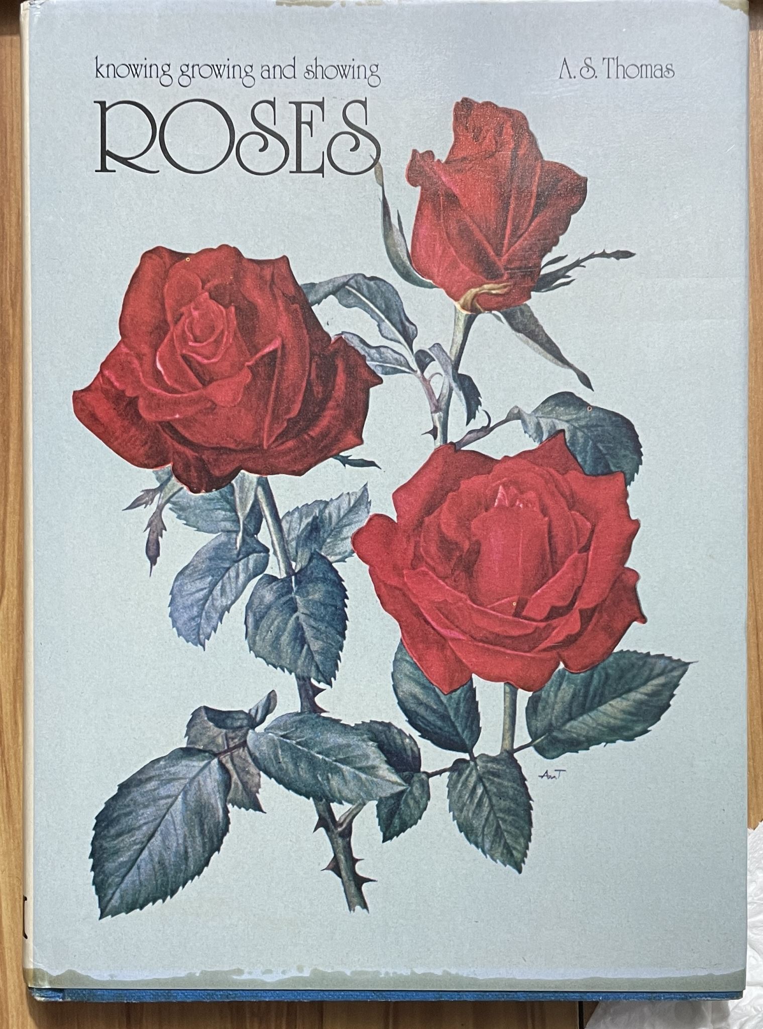 Knowing, growing and showing roses by A S Thomas